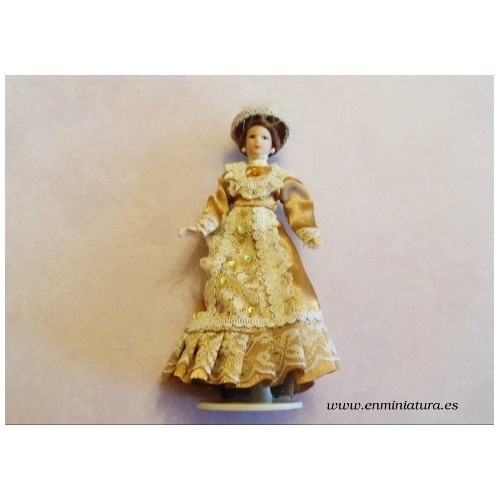 Muñeca victoriana dorada