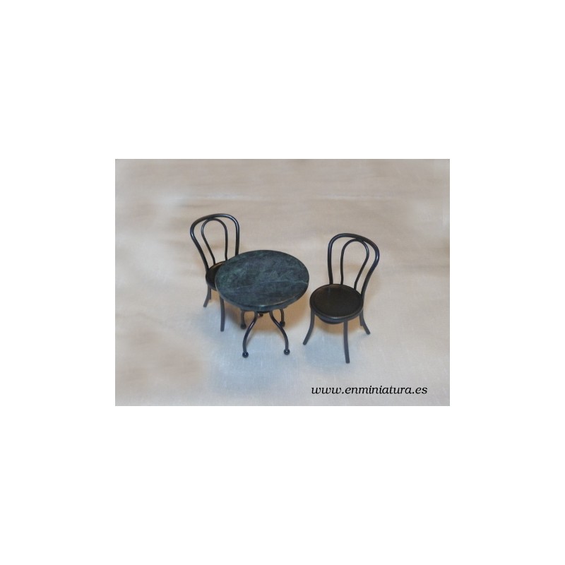 Mesa de mármol negra con sillas